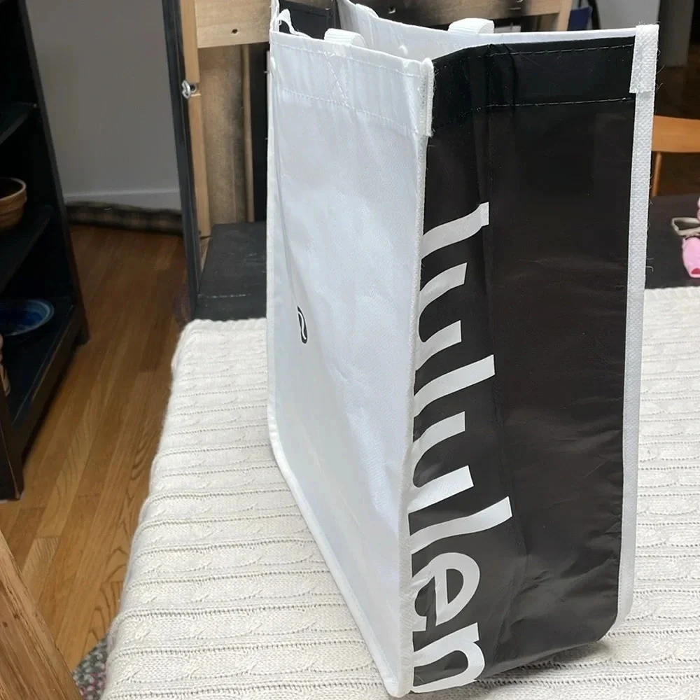 Lululemon reusable tote Snap closure. Black and white. 16” long x 14” wide x 6”